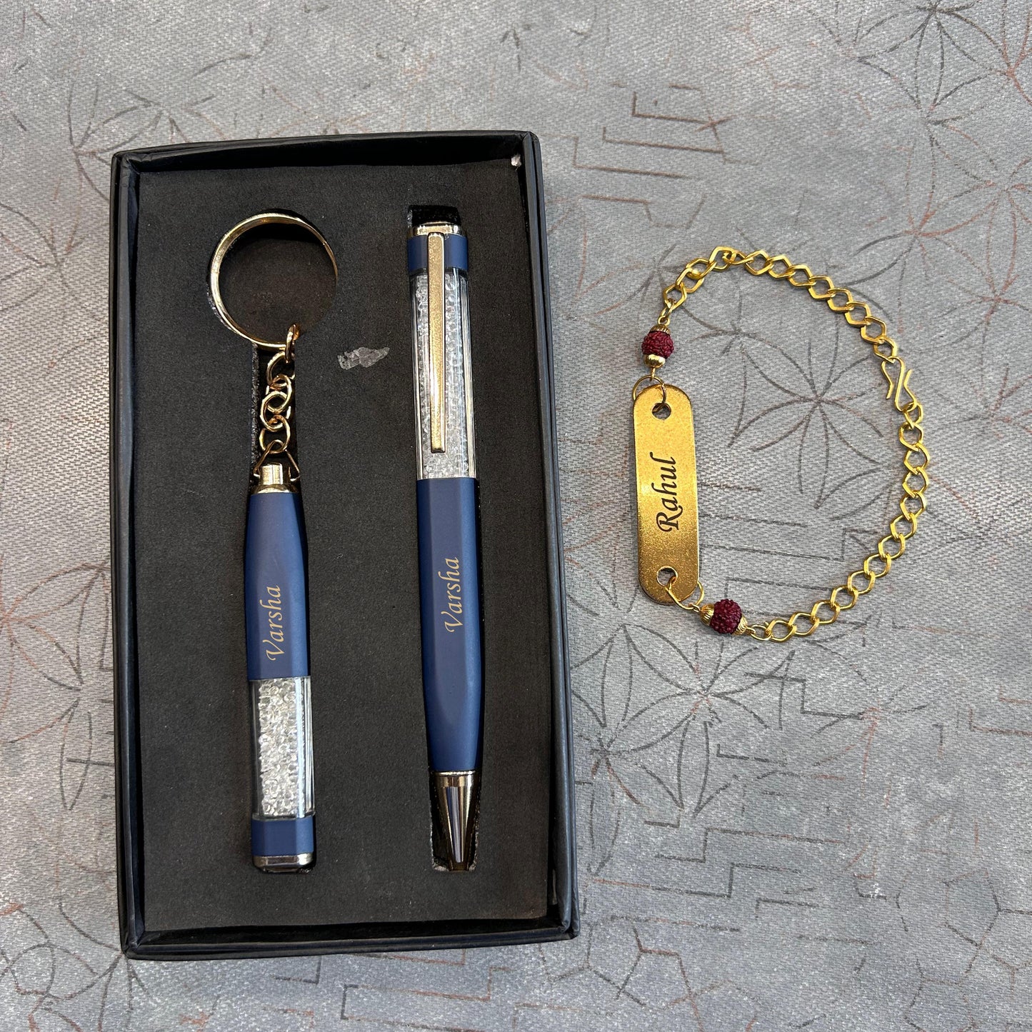 Pen, keychain and rakhi combo